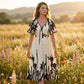Vestido midi elegante con escote en V y estampado botánic