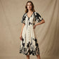 Vestido midi elegante con escote en V y estampado botánic